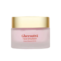 Gheesutra Face Emulsion in a frosted light pink jar with a metallic gold lid, on a solid white background.