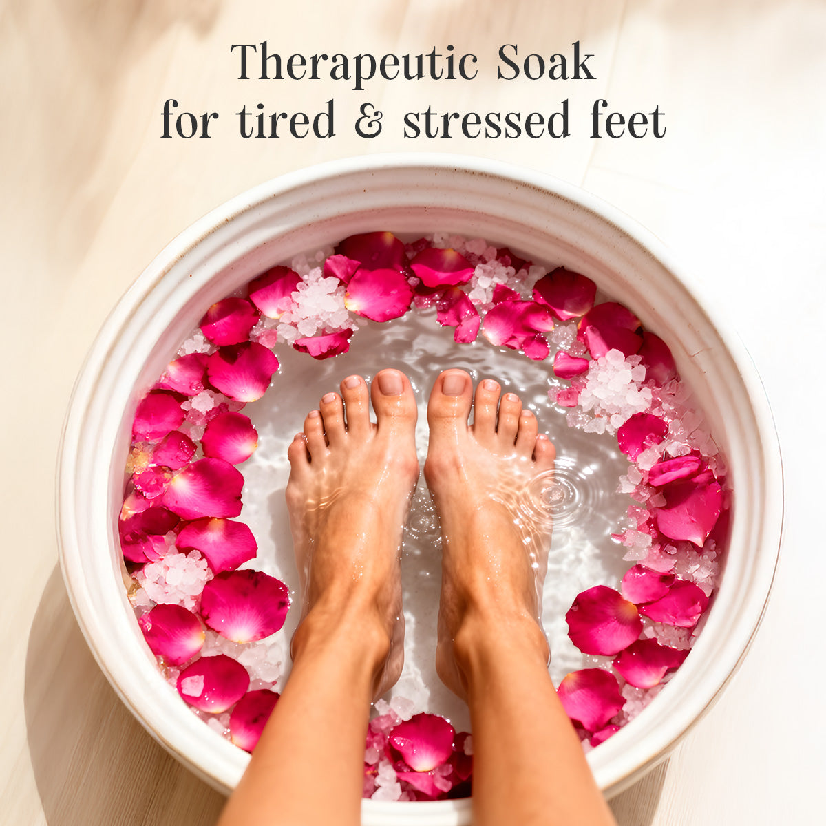 Feet in a bowl of water with pink petals and text 'Therapeutic Soak for tired & stressed feet'. (Shankara Muscle Release bath salt)